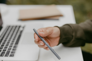 a person holding a pen